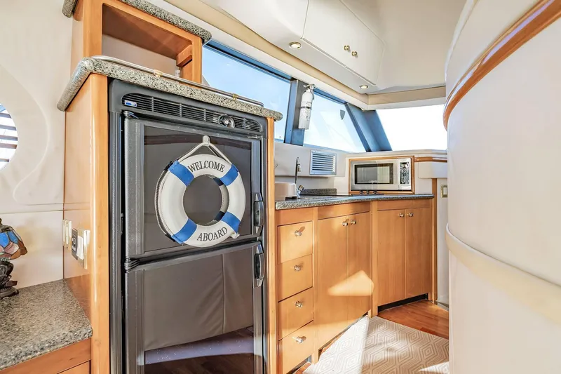 Slide: The Image of Luxurious kitchen area in 2000 Carver 450 Voyager Pilothouse yacht with modern amenities. - 40