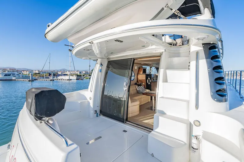 Slide: The Image of Carver 450 Voyager Pilothouse 2000 yacht with open deck and luxurious interior view. - 15