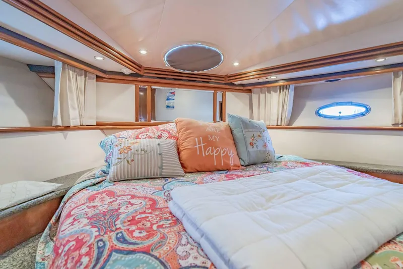 Slide: The Image of Luxurious bedroom interior of 2000 Carver 450 Voyager Pilothouse yacht with cozy bedding. - 55