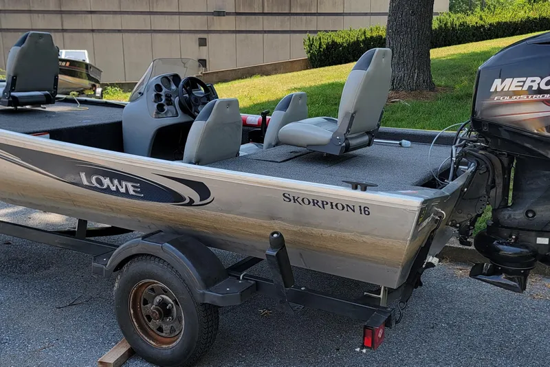 The Image of 2013 Lowe Skorpion 16 boat on trailer with Mercury outboard motor. - 0