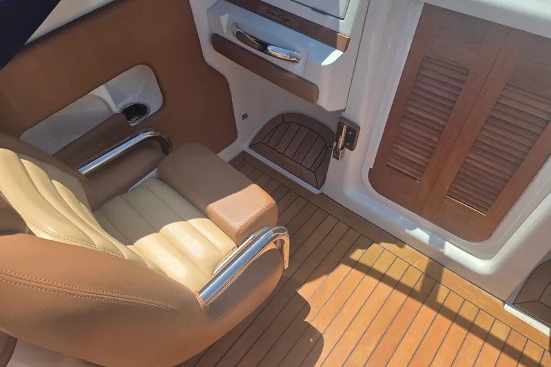 Slide: The Image of Luxurious interior of 2013 Chris-Craft Corsair 28 with leather seating and wooden flooring. - 10