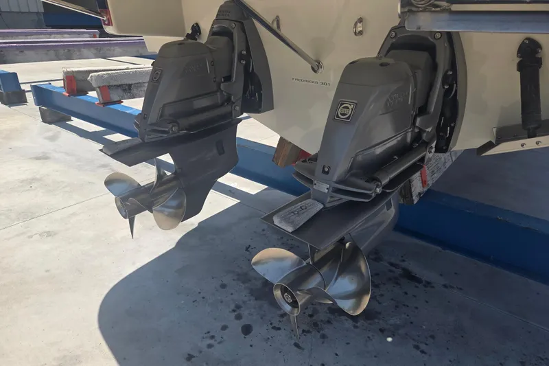 Slide: The Image of Twin propellers of a 2013 Chris-Craft Corsair 28 boat on a trailer. - 16