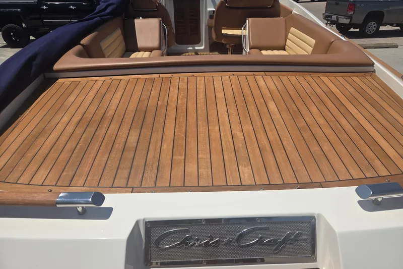 Slide: The Image of 2013 Chris-Craft Corsair 28 boat with teak deck and luxurious seating. - 20