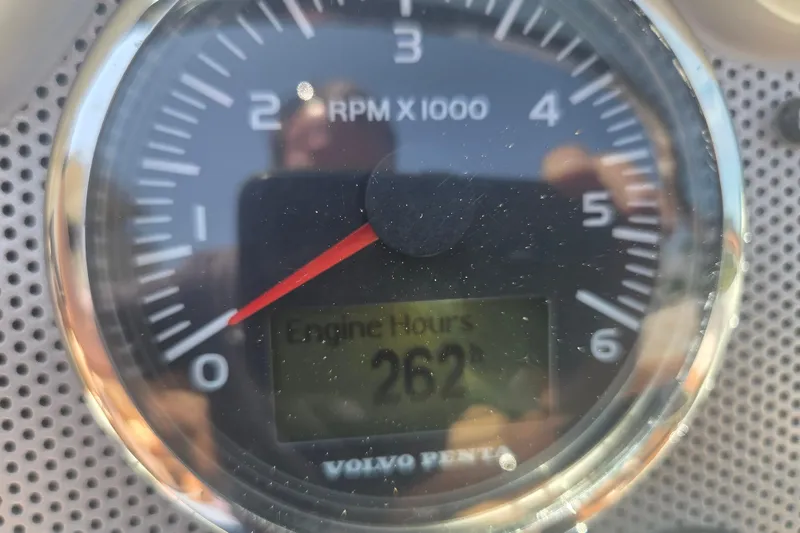 Slide: The Image of Close-up of a Volvo Penta tachometer showing 262 engine hours on a 2013 Chris-Craft Corsair 28. - 22