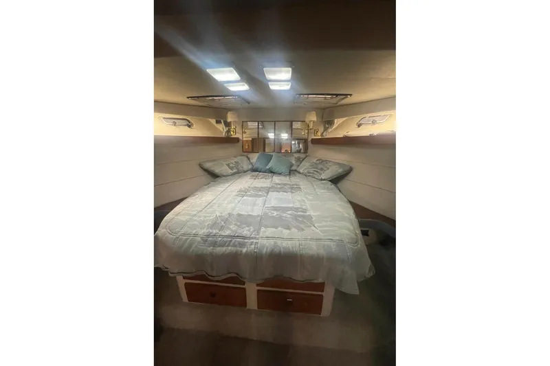 Slide: The Image of Luxurious bedroom interior of 1988 Bayliner 4588 Pilothouse yacht with cozy bedding. - 15