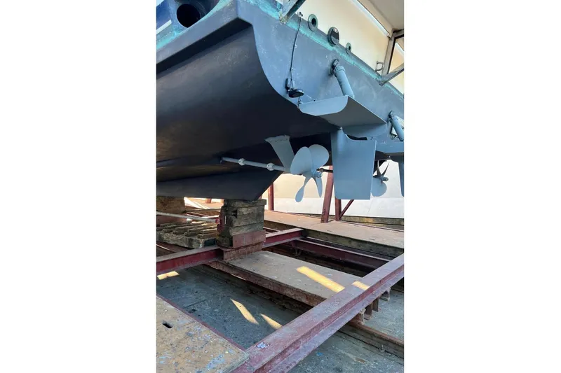 Slide: The Image of 1988 Bayliner 4588 Pilothouse boat hull and propellers on dry dock. - 37