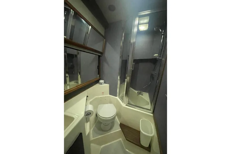Slide: The Image of Bathroom interior of 1988 Bayliner 4588 Pilothouse yacht with shower and toilet. - 16