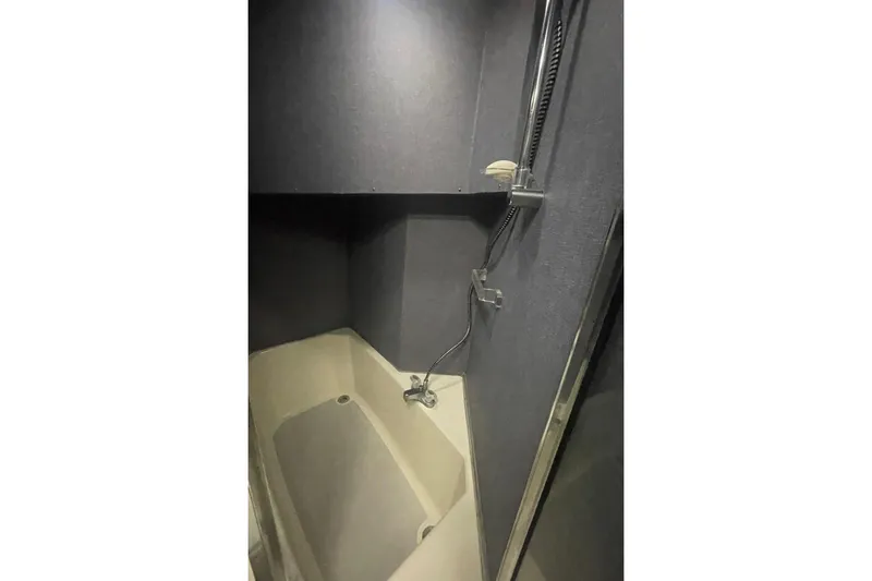 Slide: The Image of Shower area in 1988 Bayliner 4588 Pilothouse yacht, featuring modern fixtures and sleek design. - 18