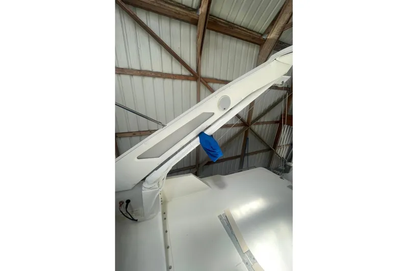 Slide: The Image of 1988 Bayliner 4588 Pilothouse boat detail in a storage facility, showcasing structural elements. - 22