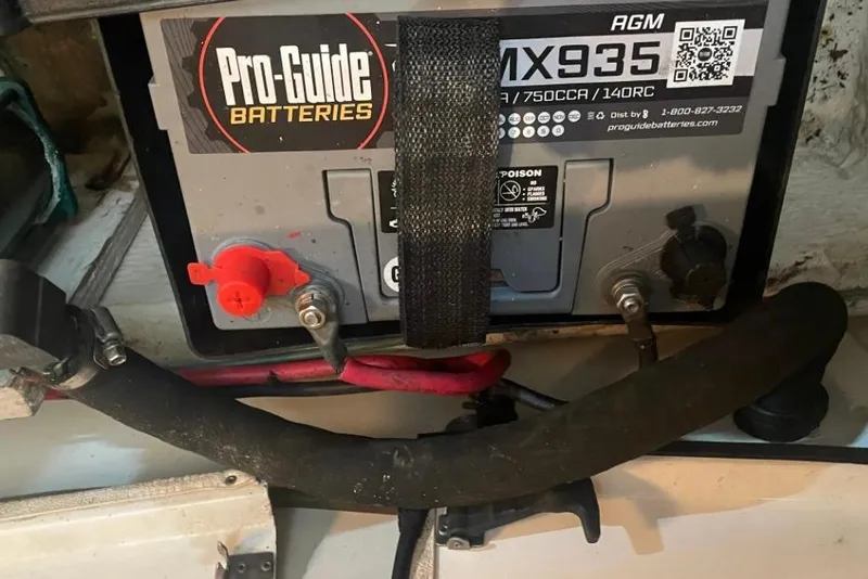 Slide: The Image of Battery installation in a 1988 Bayliner 4588 Pilothouse, featuring Pro-Guide MX935 AGM battery. - 33