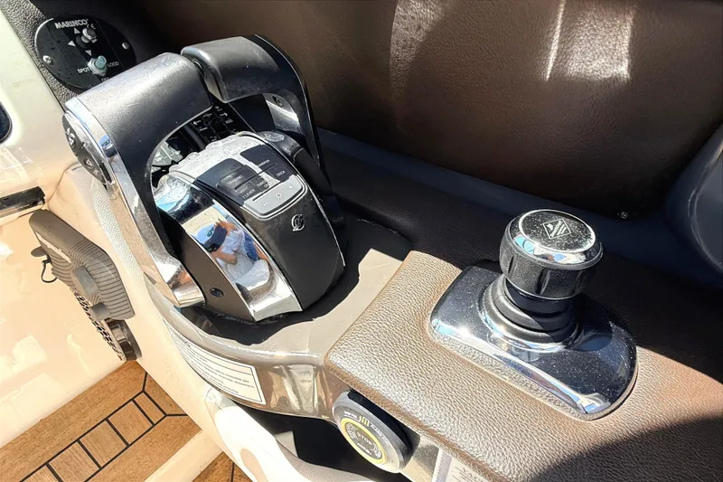 Slide: The Image of Control panel of 2016 Sea Ray SLX 350 boat with throttle and joystick. - 15