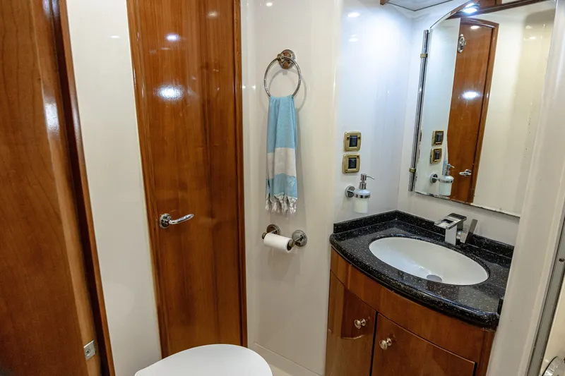 Slide: The Image of The image shows an elegant bathroom with wood paneling, a sink, and a mirror. - 27