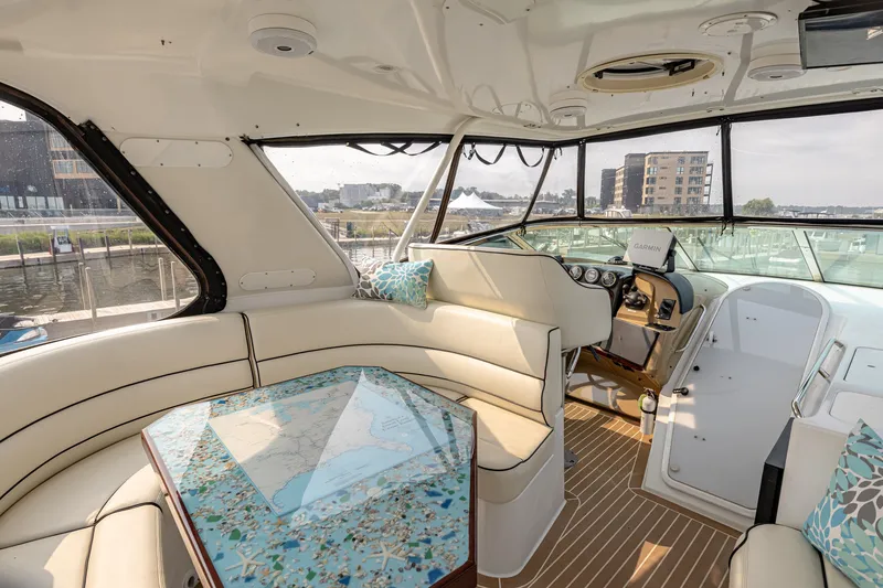 Slide: The Image of Interior of the 2002 Carver 530 Voyager Pilothouse with elegant seating area and helm station. - 5