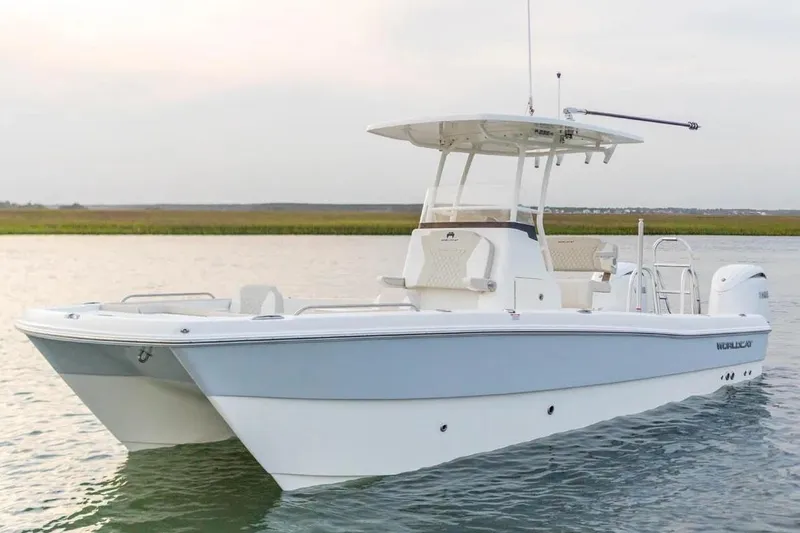 Slide: The Image of Manufacturer Provided Image: 2026 World Cat 235 HB boat on calm water, featuring sleek design and modern amenities. - 2