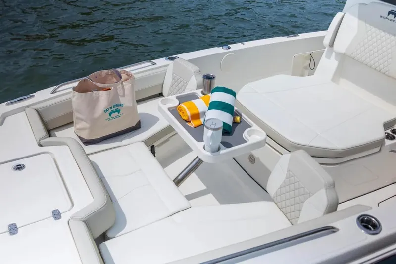 Slide: The Image of Manufacturer Provided Image: Luxurious seating area on 2026 World Cat 235 HB boat with accessories and water view. - 7