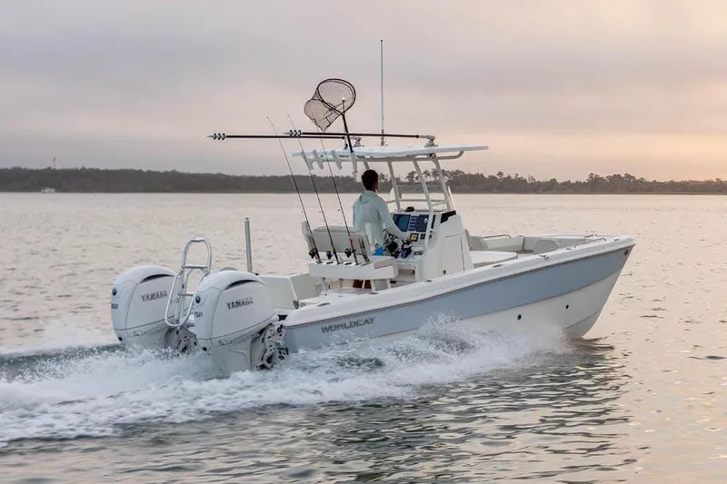 Slide: The Image of Manufacturer Provided Image: 2026 World Cat 235 HB boat cruising on calm water at sunset. - 4