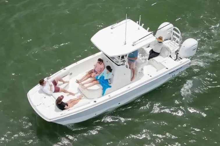 Slide: The Image of Manufacturer Provided Image: 2026 World Cat 235 HB boat with passengers cruising on open water. - 5