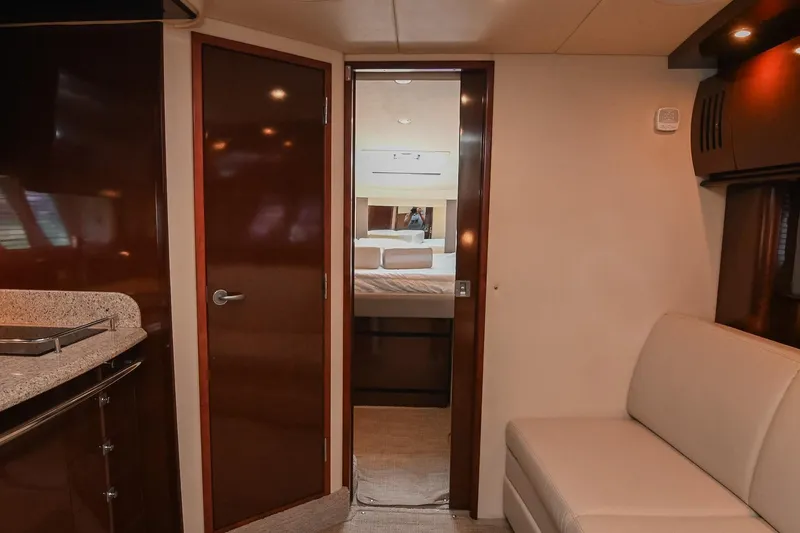 Slide: The Image of Interior of 2008 Sea Ray 38 Sundancer yacht, featuring a cozy cabin and modern amenities. - 49