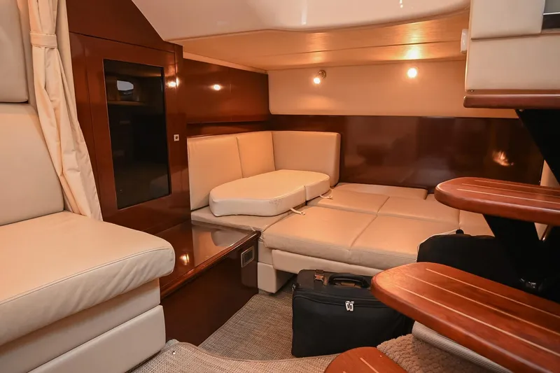 Slide: The Image of Luxurious interior of 2008 Sea Ray 38 Sundancer yacht with beige seating and wooden accents. - 37