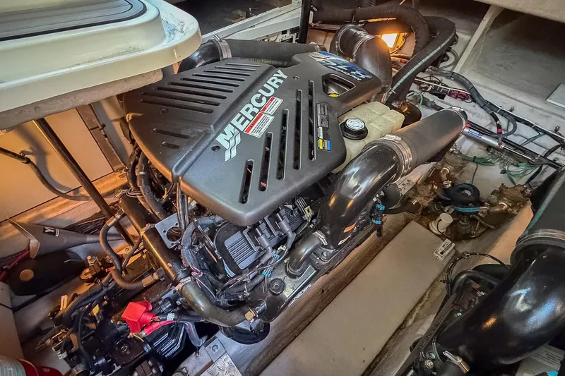 Slide: The Image of Engine compartment of a 2008 Sea Ray 38 Sundancer with Mercury engine components. - 60