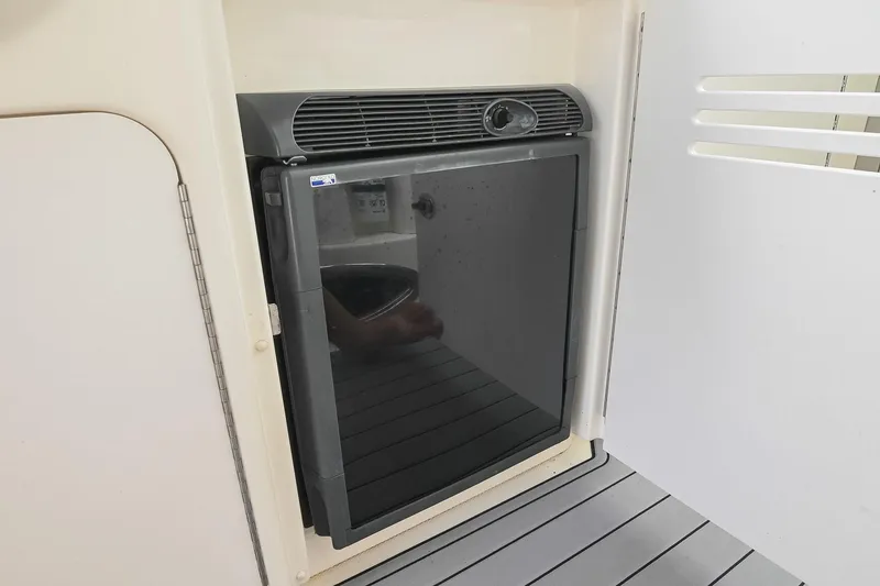 Slide: The Image of Compact refrigerator on 2008 Sea Ray 38 Sundancer yacht, sleek design, integrated in cabin. - 16