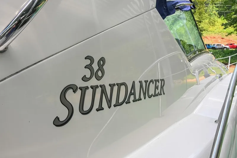 Slide: The Image of 2008 Sea Ray 38 Sundancer boat exterior with model name displayed. - 25