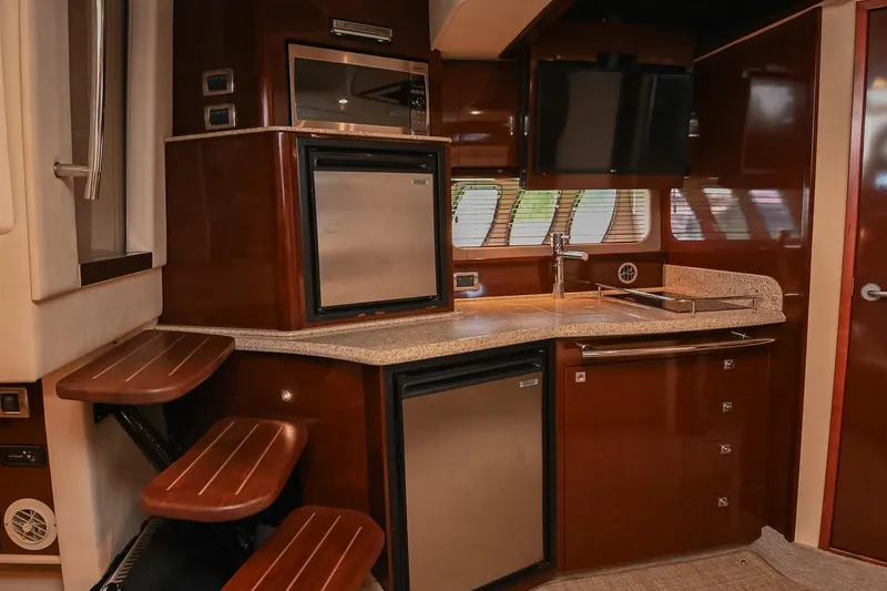 Slide: The Image of Luxurious 2008 Sea Ray 38 Sundancer yacht interior with modern kitchen amenities. - 32