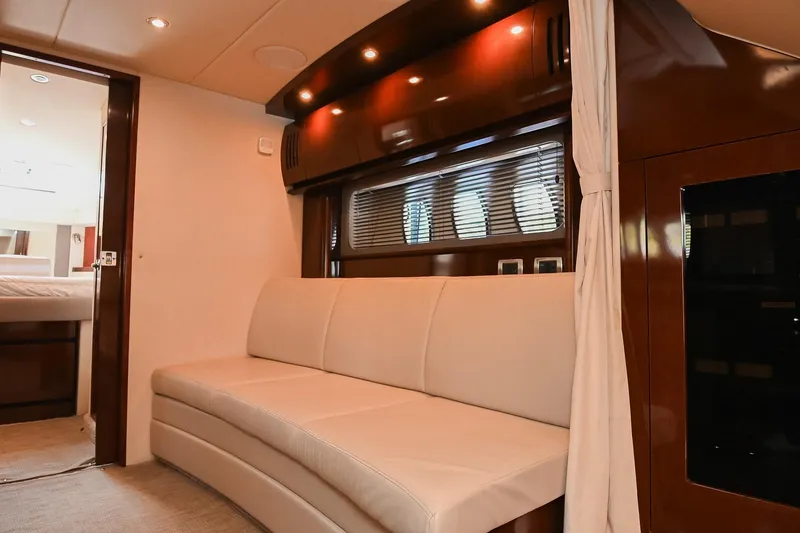 Slide: The Image of Luxurious interior of 2008 Sea Ray 38 Sundancer yacht with elegant seating and wood finishes. - 47