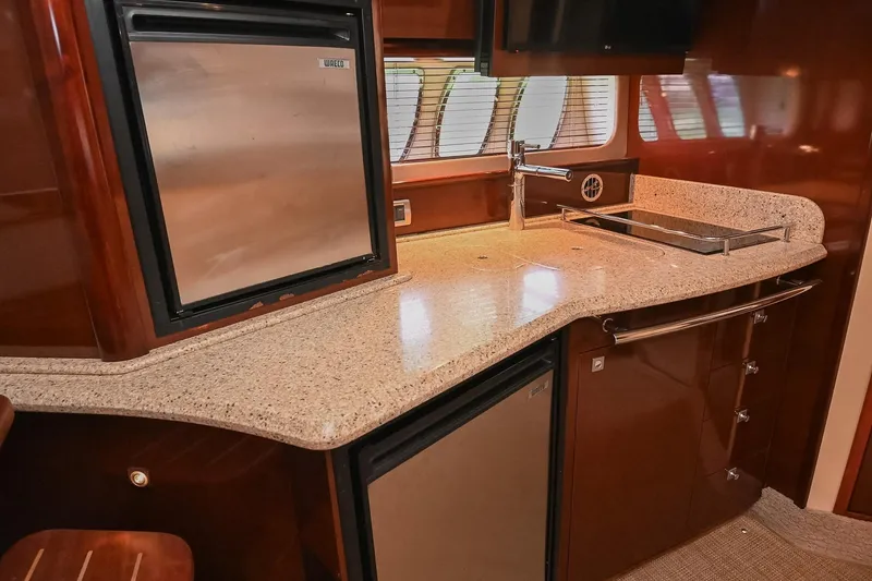 Slide: The Image of Luxurious 2008 Sea Ray 38 Sundancer yacht kitchen with sleek countertops and modern appliances. - 33