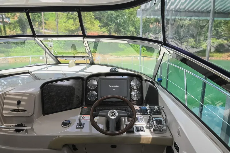 Slide: The Image of Helm of 2008 Sea Ray 38 Sundancer yacht with navigation controls and steering wheel. - 20