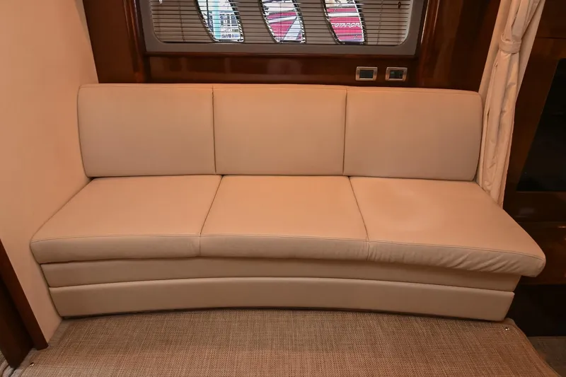 Slide: The Image of Luxurious beige sofa inside 2008 Sea Ray 38 Sundancer yacht cabin. - 46