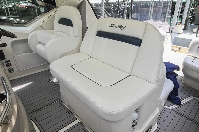 Slide: The Image of Interior seating of 2008 Sea Ray 38 Sundancer yacht, featuring white leather upholstery. - 18