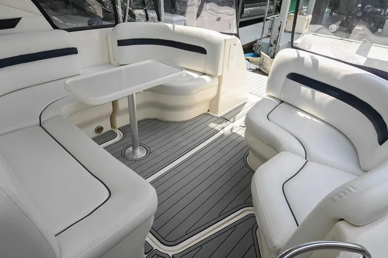 Slide: The Image of Luxurious seating area on a 2008 Sea Ray 38 Sundancer yacht with elegant white upholstery. - 8