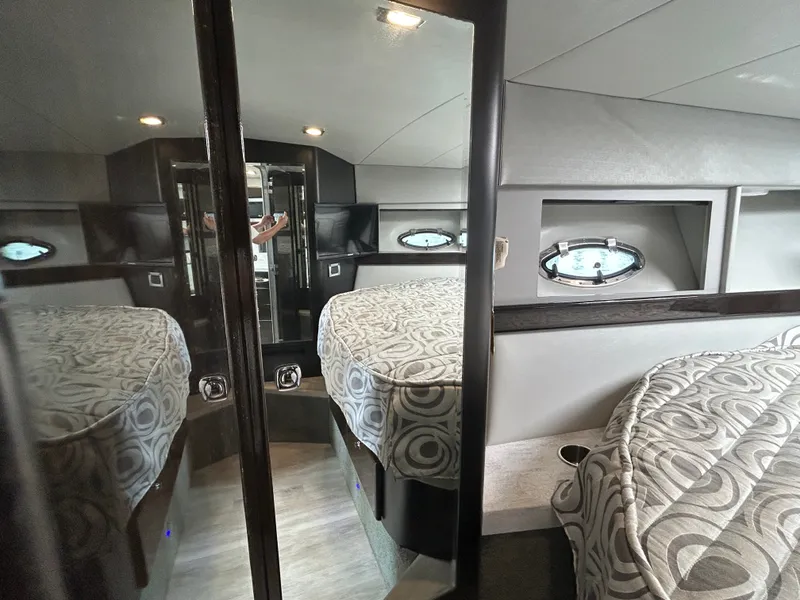 Slide: The Image of The cabin of a 2017 Formula 37 Performance Cruiser with a cozy bed and porthole windows. - 31