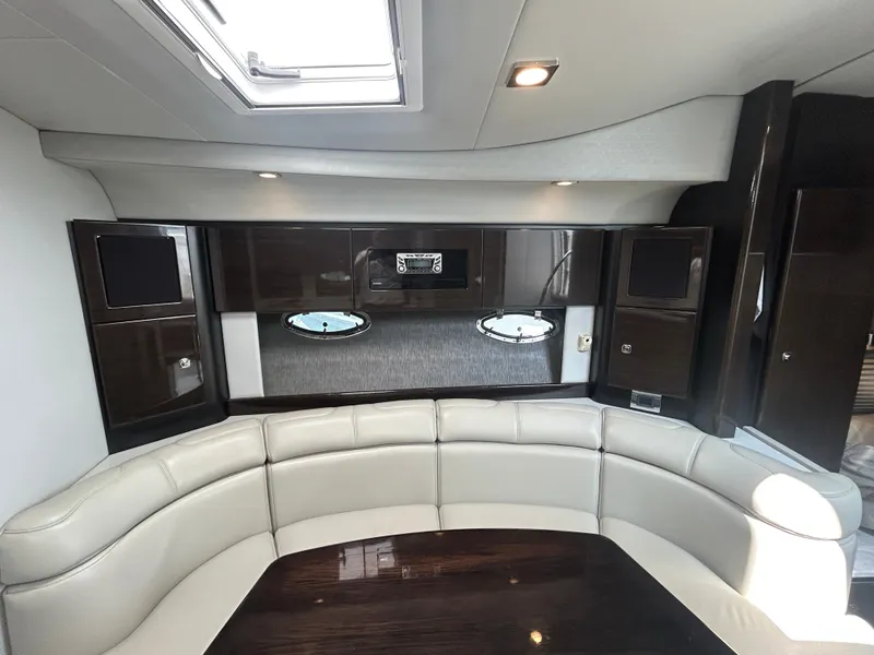 Slide: The Image of The image shows the interior of a 2017 Formula 37 Performance Cruiser with elegant white leather seating and dark wood accents. - 49