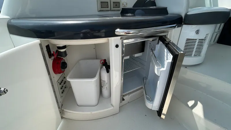 Slide: The Image of The galley of a 2017 Formula 37 Performance Cruiser features an open fridge and storage space. - 15