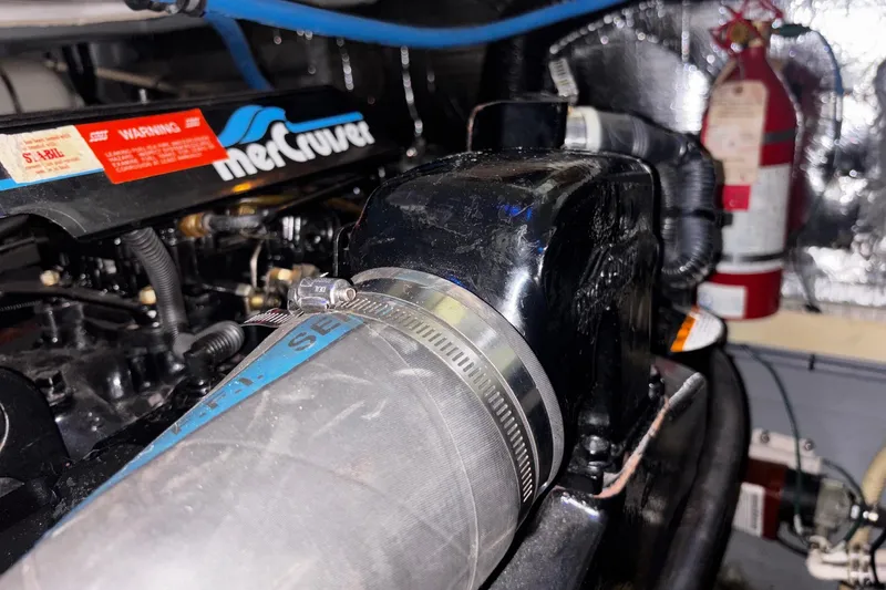 Slide: The Image of Engine compartment of a 1994 Sea Ray 400 Express Cruiser with MerCruiser components. - 25