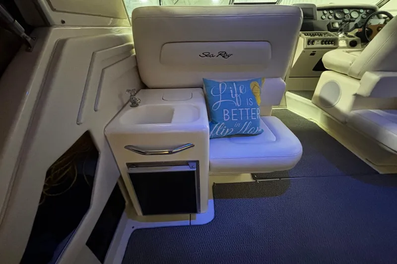 Slide: The Image of Interior of 1994 Sea Ray 400 Express Cruiser with seating and nautical decor. - 20