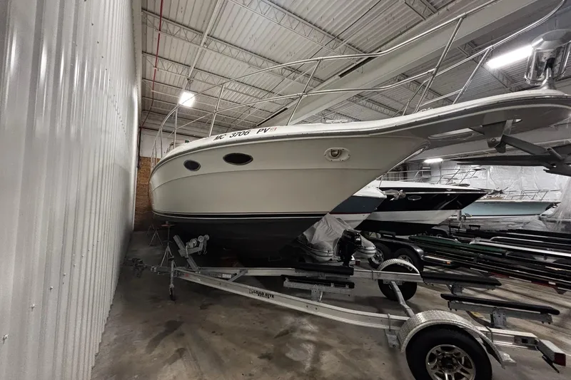Slide: The Image of 1994 Sea Ray 400 Express Cruiser stored indoors on a trailer. - 2