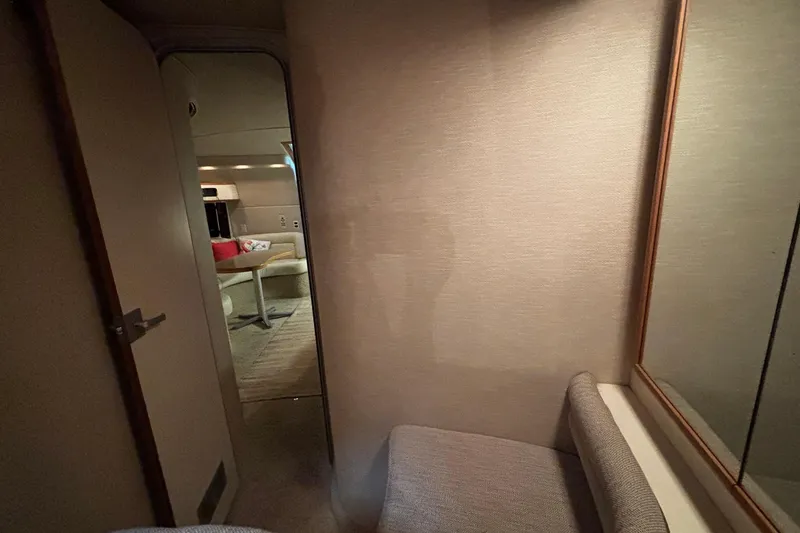 Slide: The Image of Interior of a 1994 Sea Ray 400 Express Cruiser, featuring a cozy cabin space. - 7