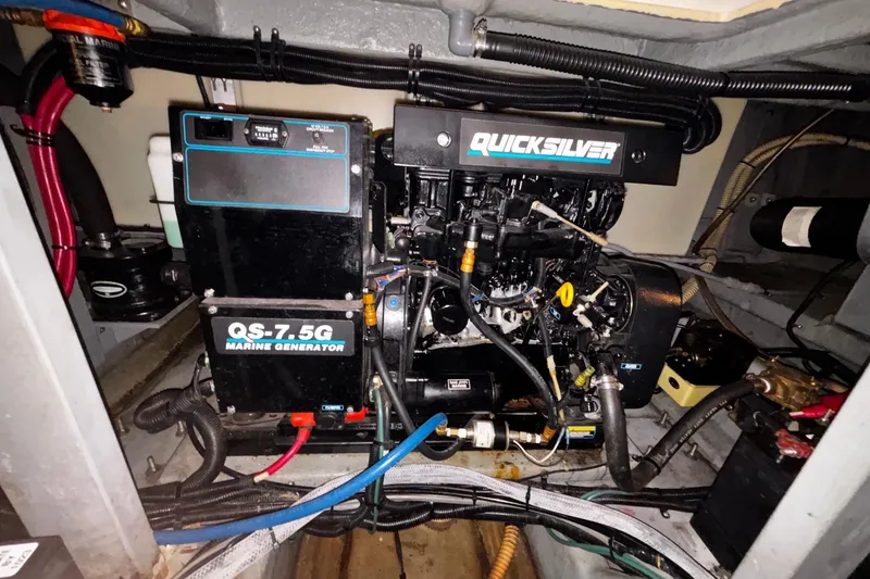 Slide: The Image of Engine room of a 1994 Sea Ray 400 Express Cruiser with Quicksilver marine generator. - 22