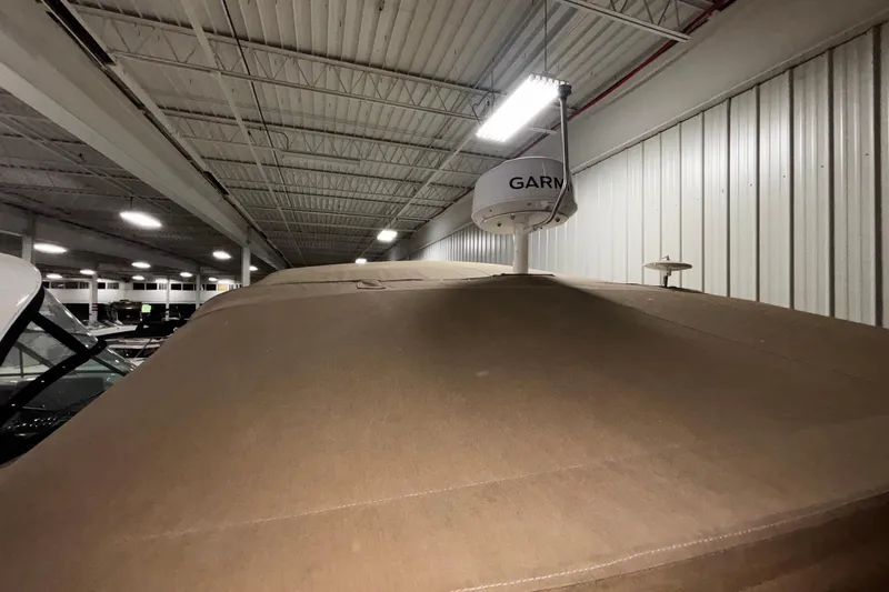 Slide: The Image of 1994 Sea Ray 400 Express Cruiser in indoor storage with Garmin radar. - 28