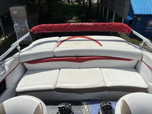 Slide: The Image of The image shows the cockpit of a 2007 Four Winns 200 Horizon with white upholstery and red accents. - 12