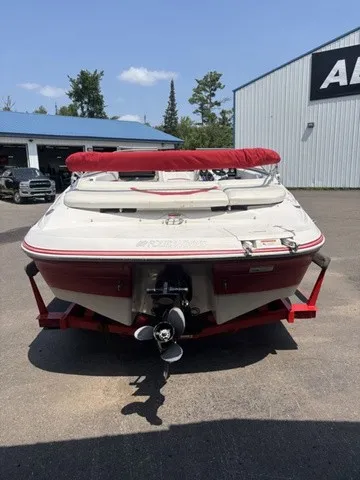Slide: The Image of A 2007 Four Winns 200 Horizon boat on a trailer, featuring a red canopy and propeller. - 7
