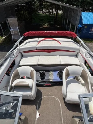 Slide: The Image of The image shows the cockpit of a 2007 Four Winns 200 Horizon with white seats and a wakeboard. - 15