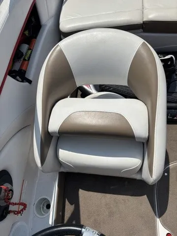 Slide: The Image of A cushioned boat seat in white and beige, surrounded by a clean deck area. - 11