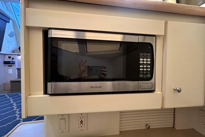 Slide: The Image of Built-in West Bend microwave in 1999 Carver 326 Aft Cabin Motor Yacht kitchen. - 19