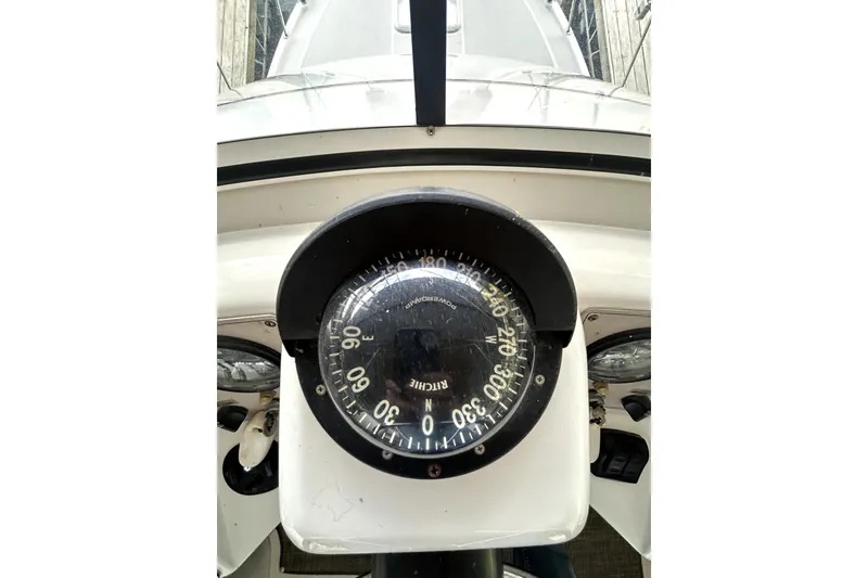 Slide: The Image of Compass on 1999 Carver 326 Aft Cabin Motor Yacht dashboard, showing navigation details. - 10