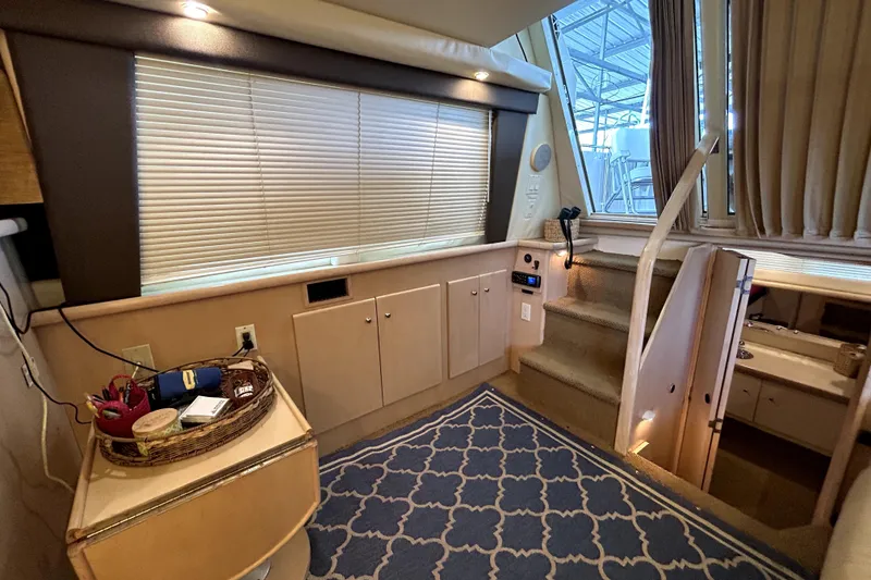 Slide: The Image of Interior of 1999 Carver 326 Aft Cabin Motor Yacht with stairs and cabinets. - 18
