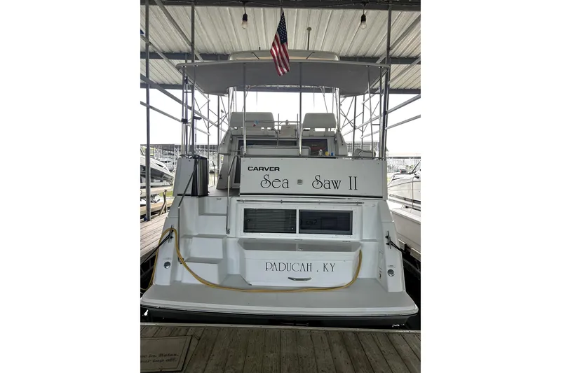 Slide: The Image of 1999 Carver 326 Aft Cabin Motor Yacht docked, named "Sea = Saw II," located in Paducah, KY. - 8